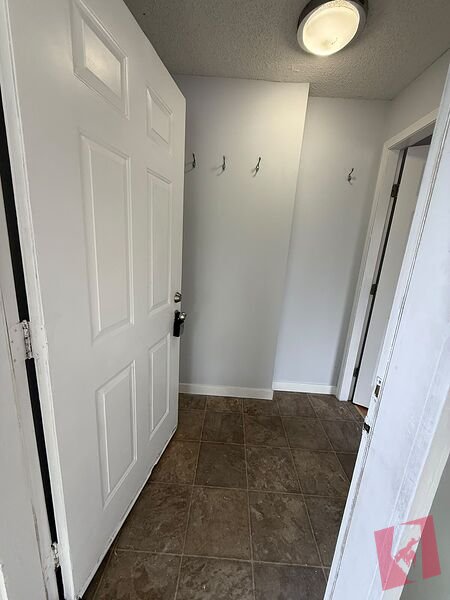 3 Bedroom Main Floor Suite in Falconridge NE | In Suite Laundry and Deck photo 2