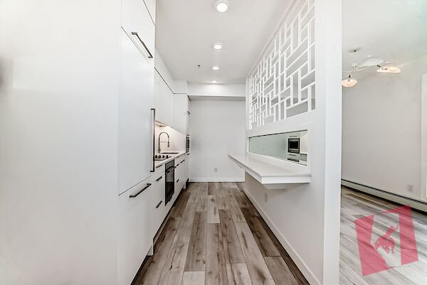 Immaculate Modern 1 Bed Condo with heated parking. Deck overlooking the Garden