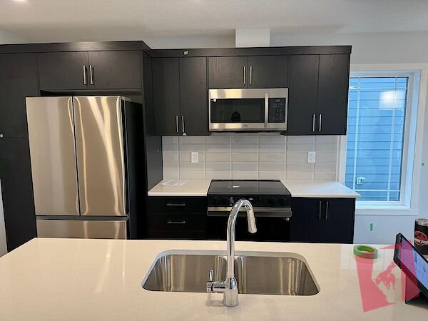 New Three (3) Bedroom Townhouse with attached double garage photo 3