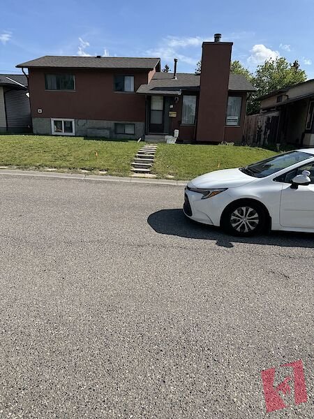 Fully Developed Four (4) Level House with a 2 bedrooms legal suite in basement