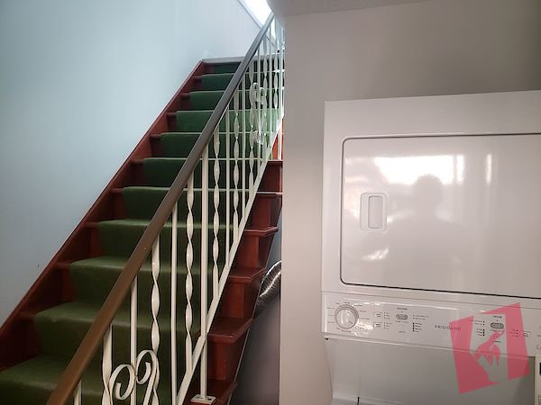 Renovated two bedroom top floor suite with private fenced yard