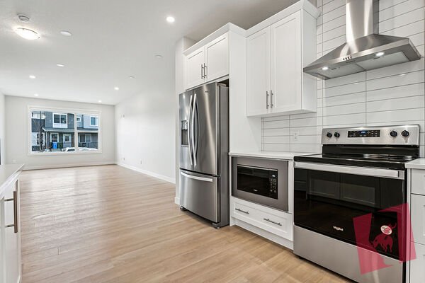 Main Floor Legalized Unit in Modern Townhome in Sage Hill with Double Garage! photo 2