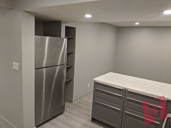 Basement suite w/ detached double wide garage for rent on Queensland drive