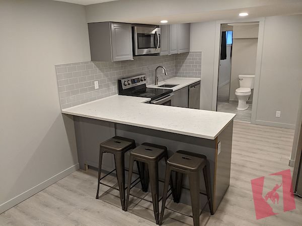 Basement suite w/ detached double wide garage for rent on Queensland drive photo 2