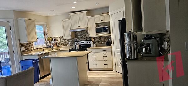 Rare 5-Bedroom Renovated Family Home with Office, Double Garage & Private Treed
